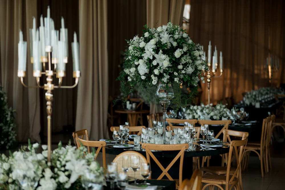 Elegant table setting with floral arrangements and candles